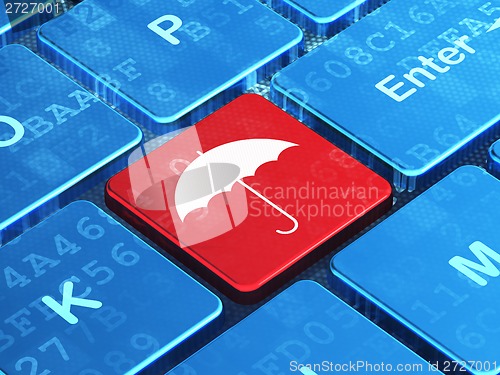 Image of Protection concept: Umbrella on computer keyboard background