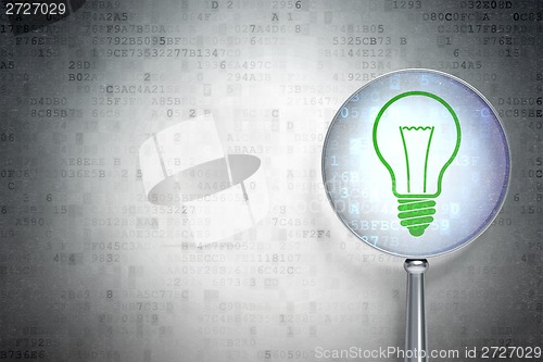 Image of Business concept:  Light Bulb with optical glass on digital background