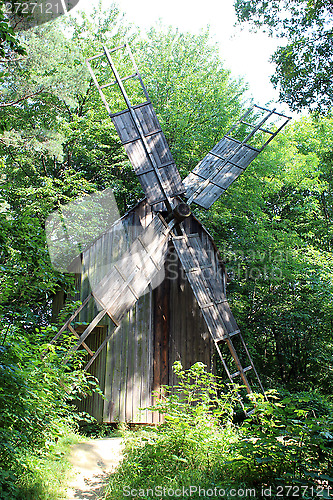 Image of big mill in the forest