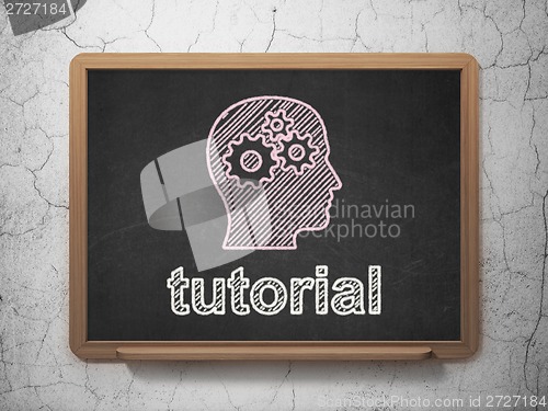 Image of Education concept: Head With Gears and Tutorial on chalkboard background