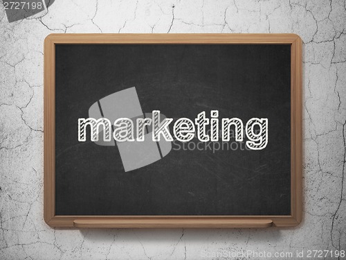 Image of Advertising concept: Marketing on chalkboard background