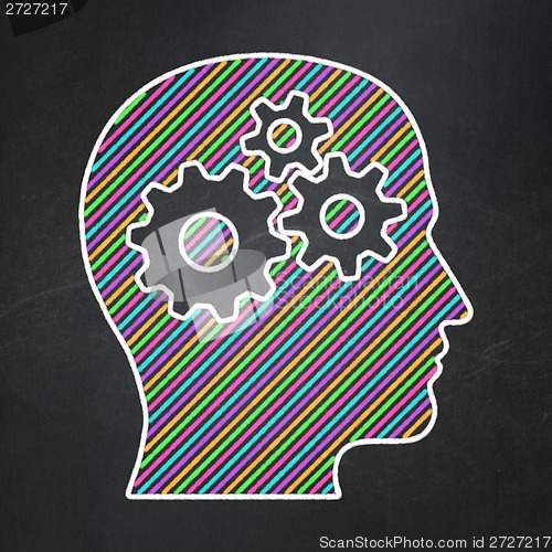 Image of Data concept: Head With Gears on chalkboard background