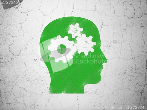 Image of Education concept: Head With Gears on wall background