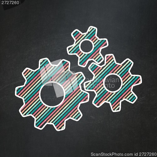 Image of Information concept: Gears on chalkboard background