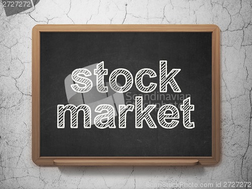 Image of Finance concept: Stock Market on chalkboard background