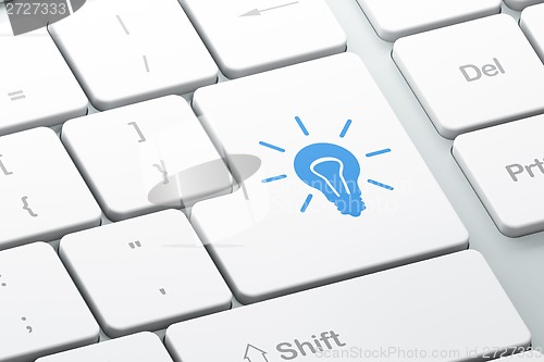 Image of Finance concept: Light Bulb on computer keyboard background