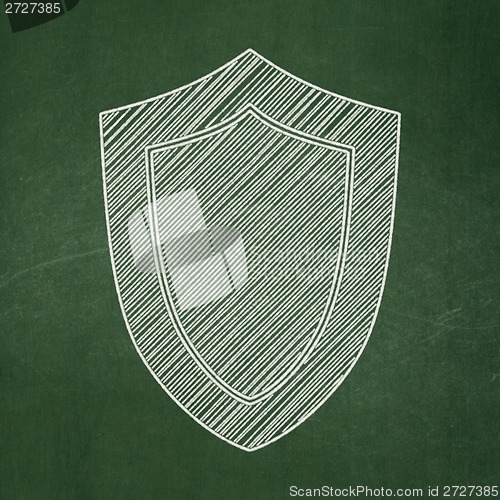 Image of Protection concept: Shield on chalkboard background