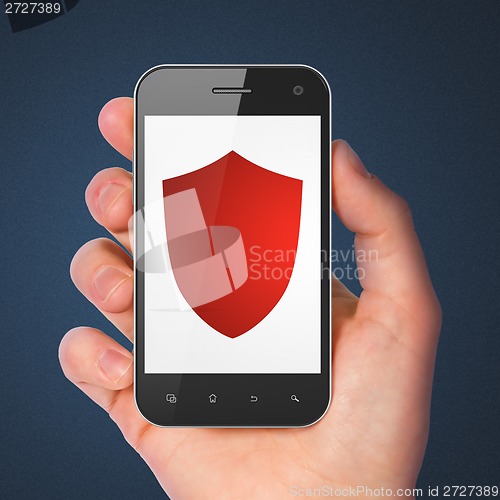 Image of Security concept: Shield on smartphone