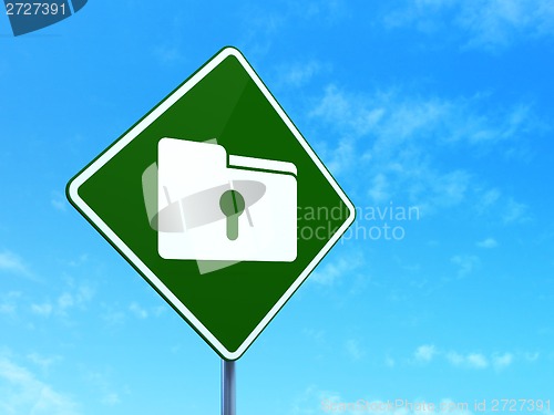 Image of Business concept: Folder With Keyhole on road sign background