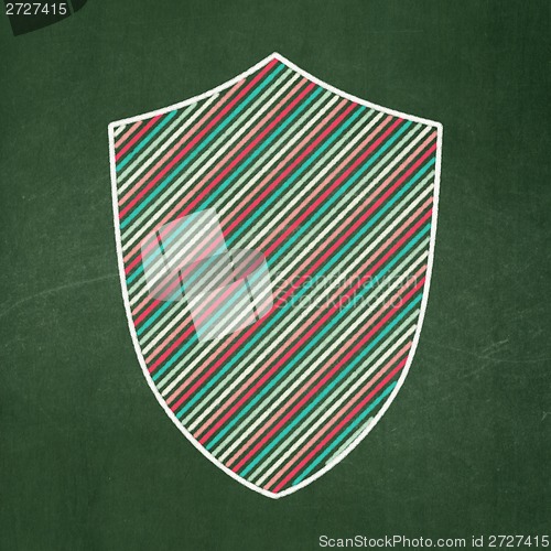 Image of Privacy concept: Shield on chalkboard background