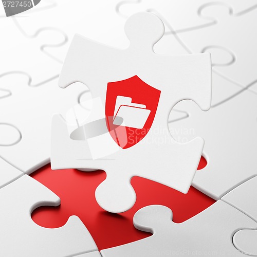 Image of Business concept: Folder With Shield on puzzle background