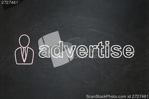 Image of Marketing concept: Business Man and Advertise on chalkboard background