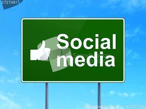 Image of Social media concept: Social Media and Thumb Up on road sign background