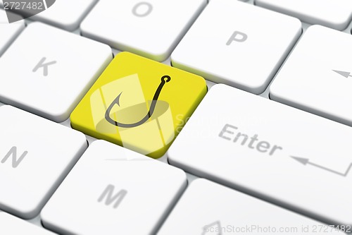 Image of Privacy concept: Fishing Hook on computer keyboard background