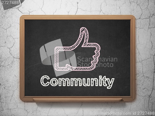 Image of Social network concept: Thumb Up and Community on chalkboard background
