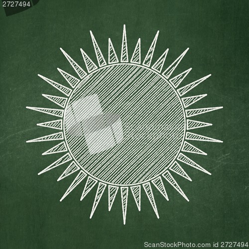 Image of Vacation concept: Sun on chalkboard background