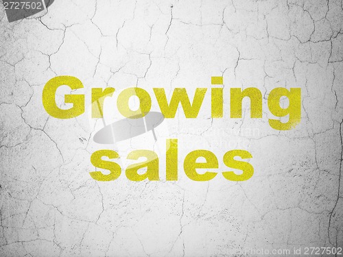 Image of Finance concept: Growing Sales on wall background