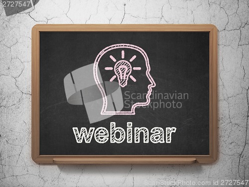 Image of Education concept: Head With Lightbulb and Webinar on chalkboard background