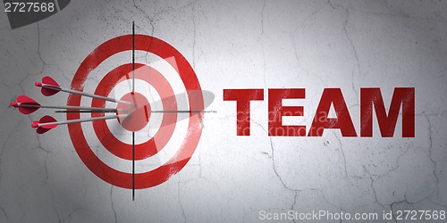 Image of Finance concept: target and Team on wall background