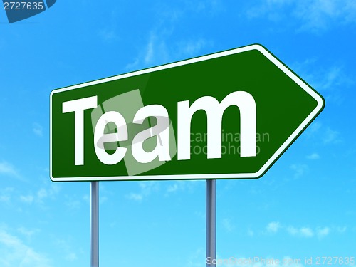 Image of Business concept: Team on road sign background