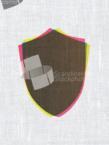 Image of Security concept: Shield on fabric texture background