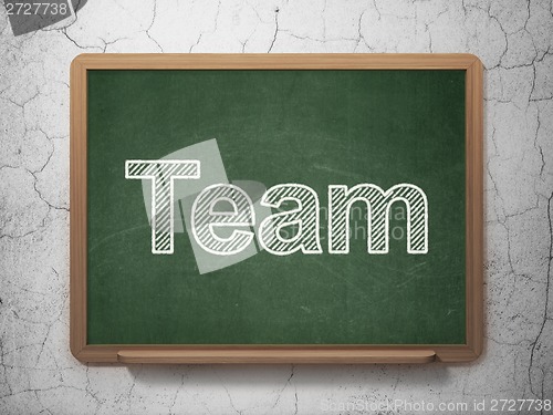 Image of Finance concept: Team on chalkboard background