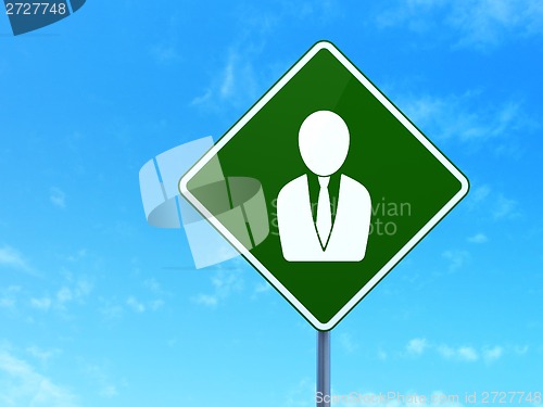 Image of Advertising concept: Business Man on road sign background