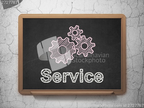 Image of Business concept: Gears and Service on chalkboard background