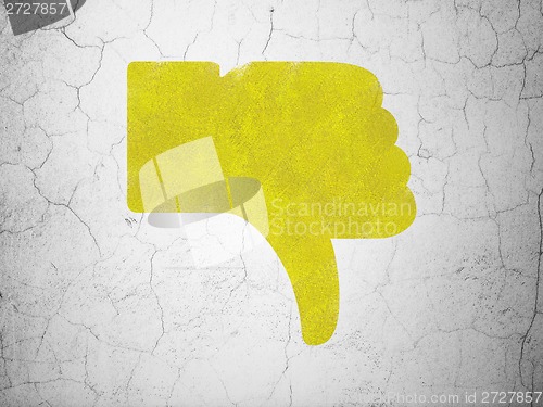 Image of Social media concept: Thumb Down on wall background