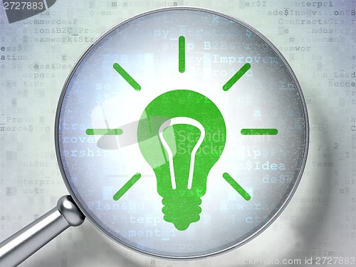 Image of Finance concept: Light Bulb with optical glass on digital background
