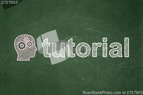 Image of Education concept: Head With Gears and Tutorial on chalkboard background