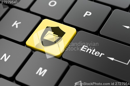 Image of Business concept: Folder With Shield on computer keyboard background