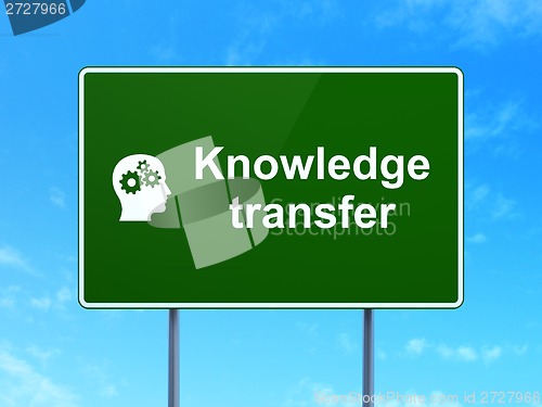Image of Education concept: Knowledge Transfer and Head With Gears on road sign background
