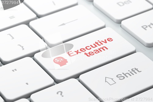 Image of Finance concept: Head With Finance Symbol and Executive Team on computer keyboard background