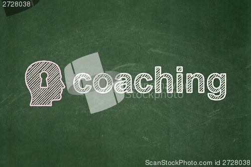 Image of Education concept: Head With Keyhole and Coaching on chalkboard background