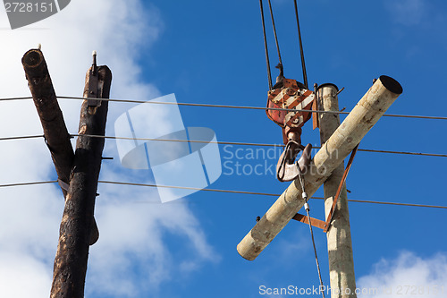 Image of Replacing old electricity pillar on a new 