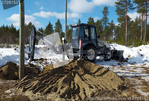 Image of Excavator digs pillar pylon 