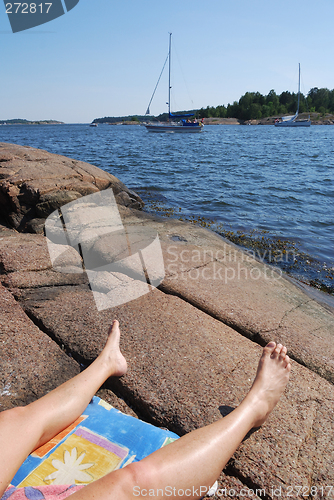 Image of Sea, sky and legs