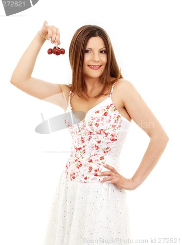 Image of beautiful brunette girl holding cherries