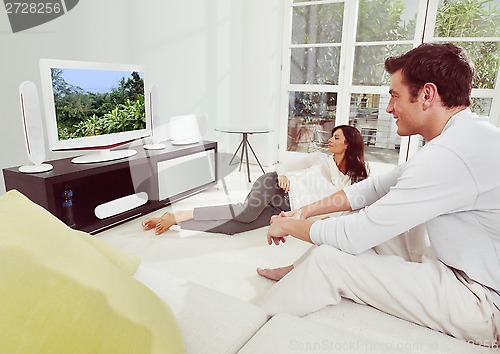 Image of happiness couple watching tv