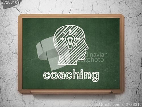 Image of Education concept: Head With Light Bulb and Coaching on chalkboard