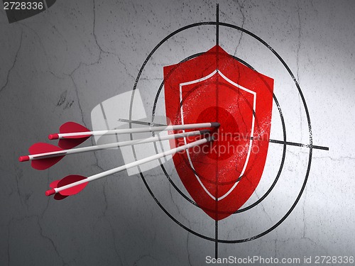 Image of Protection concept: arrows in Shield target on wall background