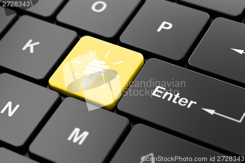 Image of Business concept: Energy Saving Lamp on computer keyboard background