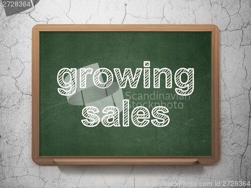 Image of Business concept: Growing Sales on chalkboard background