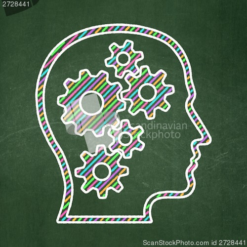 Image of Data concept: Head With Gears on chalkboard background