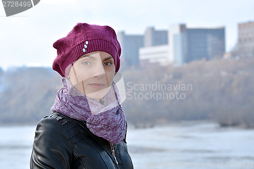 Image of Woman in a red beret and a black jacket