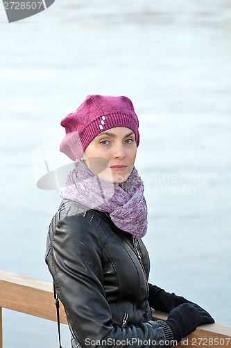 Image of Woman in a red beret and a black jacket