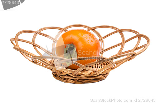 Image of Persimmon fruit in wicker