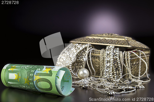 Image of Silver jewelry and Euro 
