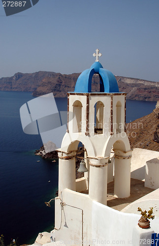 Image of greek church bell tower over sea
